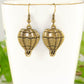 Close up of Antique Bronze Hot Air Balloon Charm Earrings.