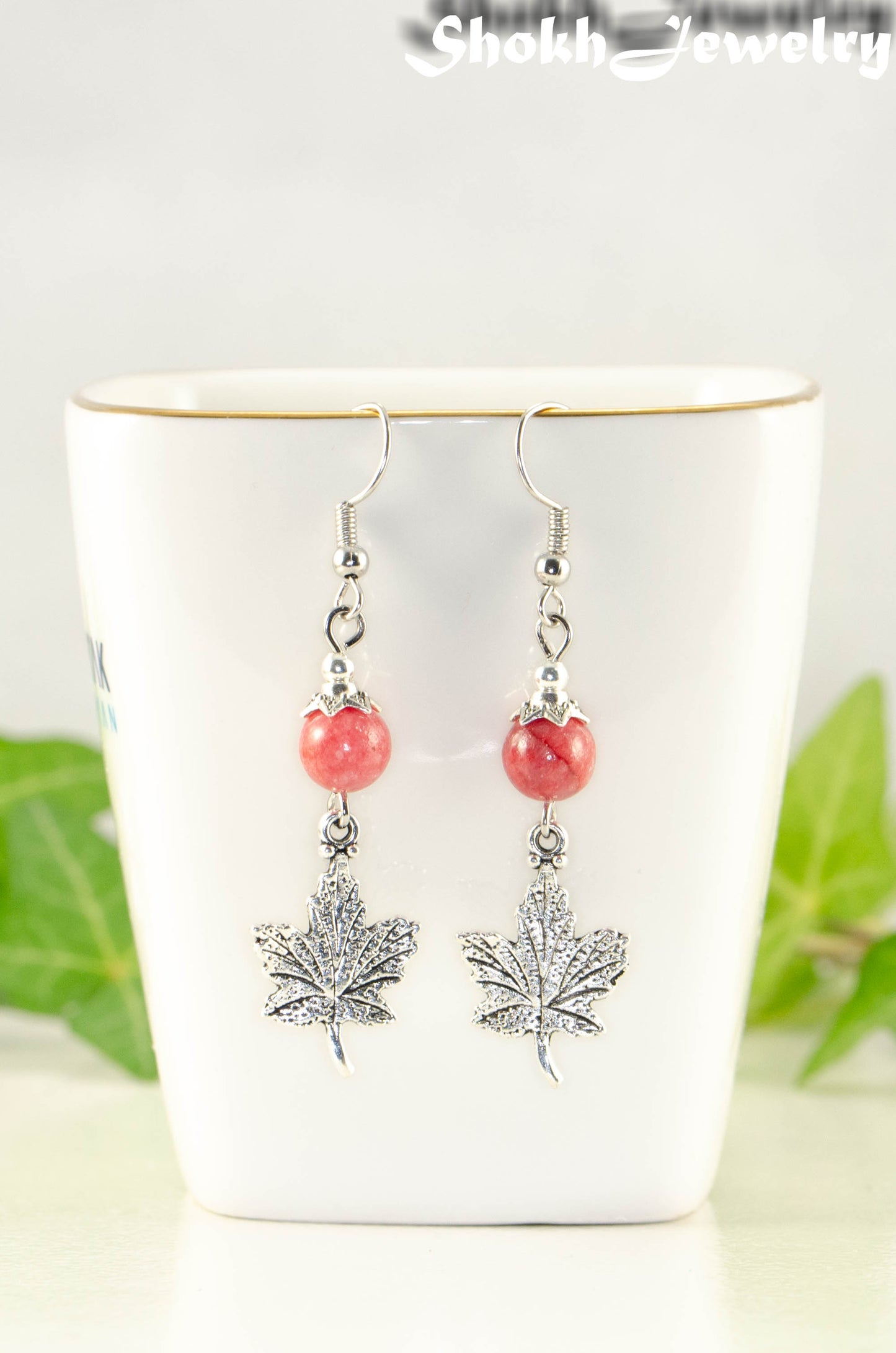 Close up of Red Quartzite and Tibetan Silver Maple Leaf Dangle Earrings.