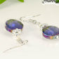 Close up of Iridescent Blue Glass Crystal Beads Earrings.