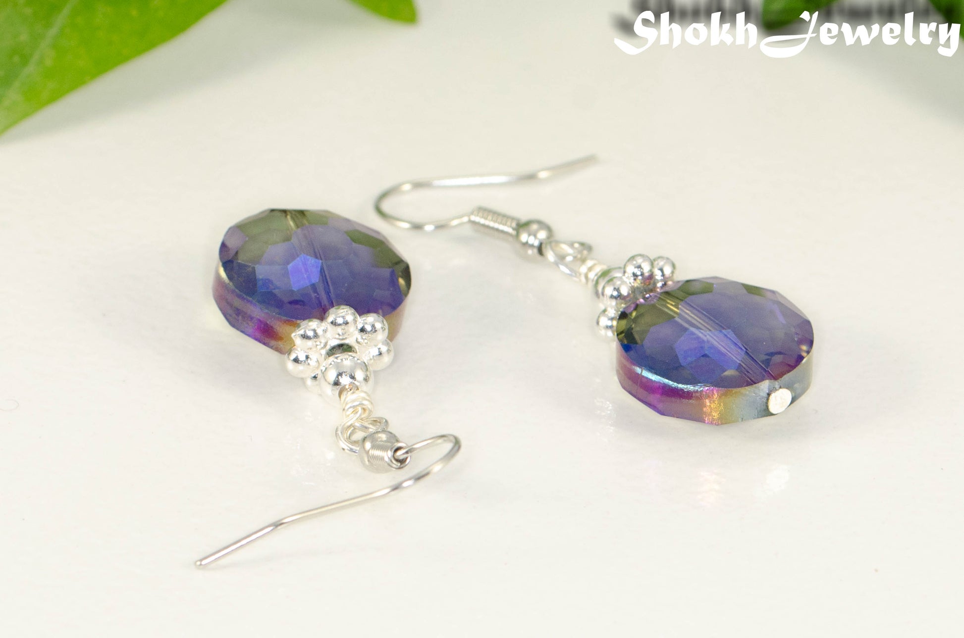 Close up of Iridescent Blue Glass Crystal Beads Earrings.