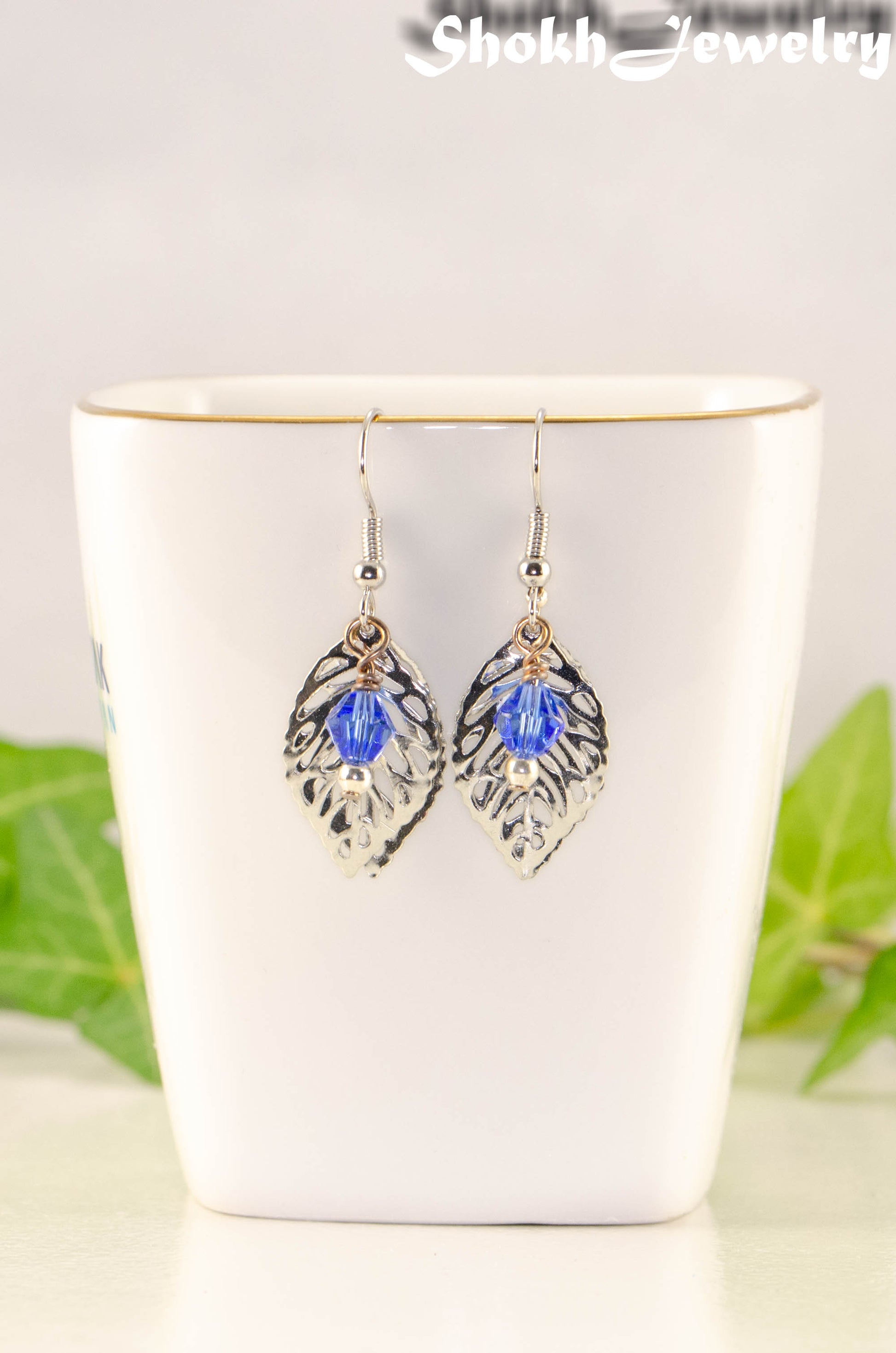 Filigree Silver Leaf Charm and Blue Glass Crystal Earrings.