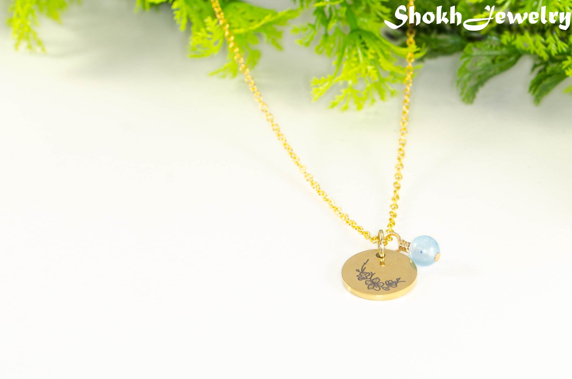 Gold Plated March Birth Flower Necklace with Aquamarine Birthstone Pendant.