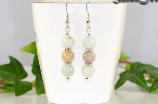 Natural Amazonite Beaded Bar Earrings displayed on a tea cup.