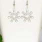 Close up of Christmas Snowflakes Charm Earrings.