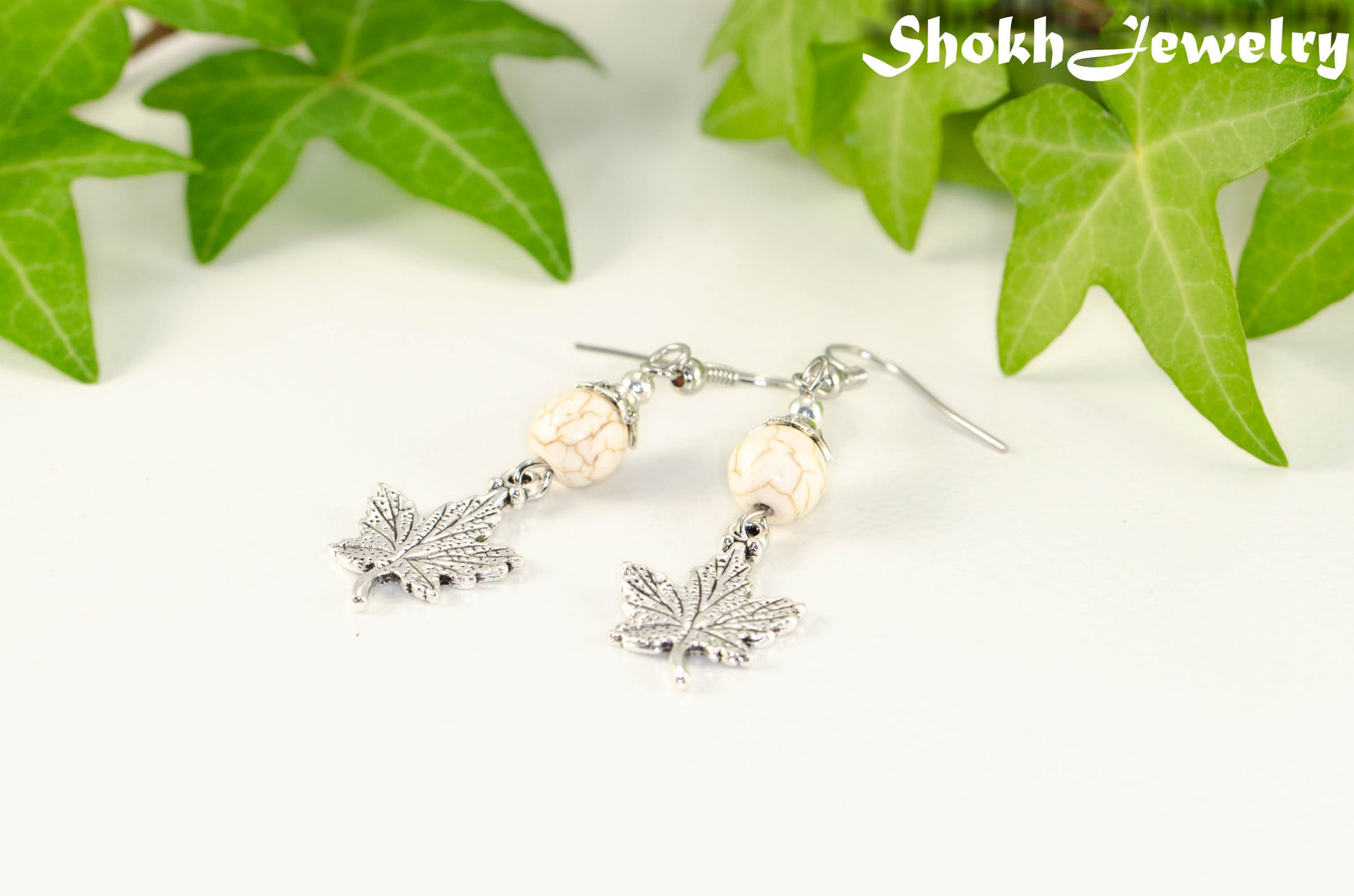 White Howlite and Tibetan Silver Maple Leaf Dangle Earrings.