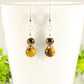 Close up of Small Tiger's Eye Earrings.