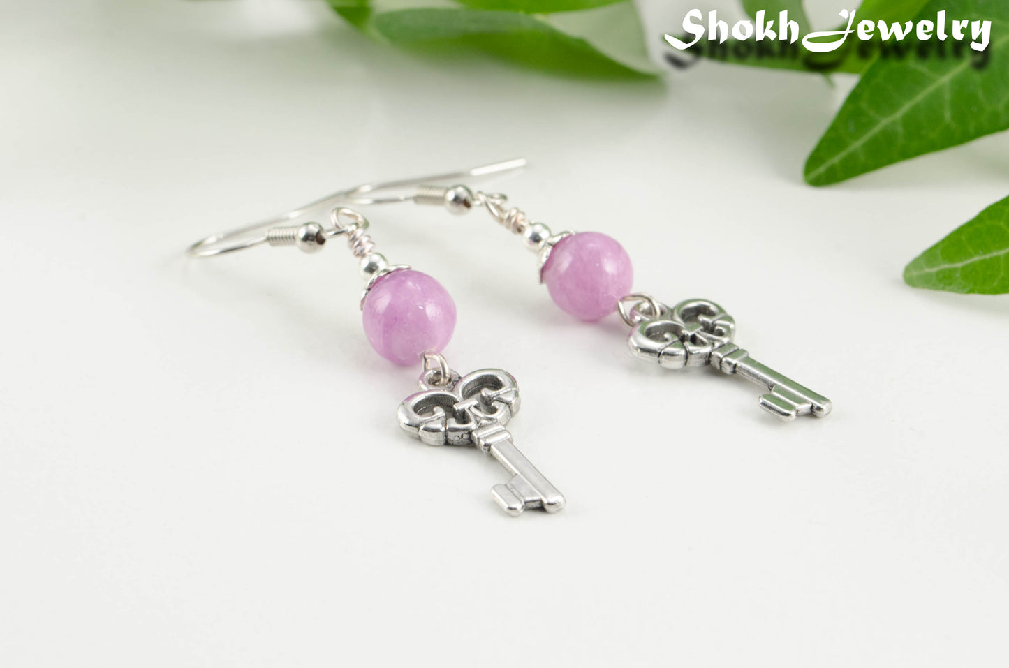 Close up of Light Purple Quartzite and Key Charm Dangle Earrings.