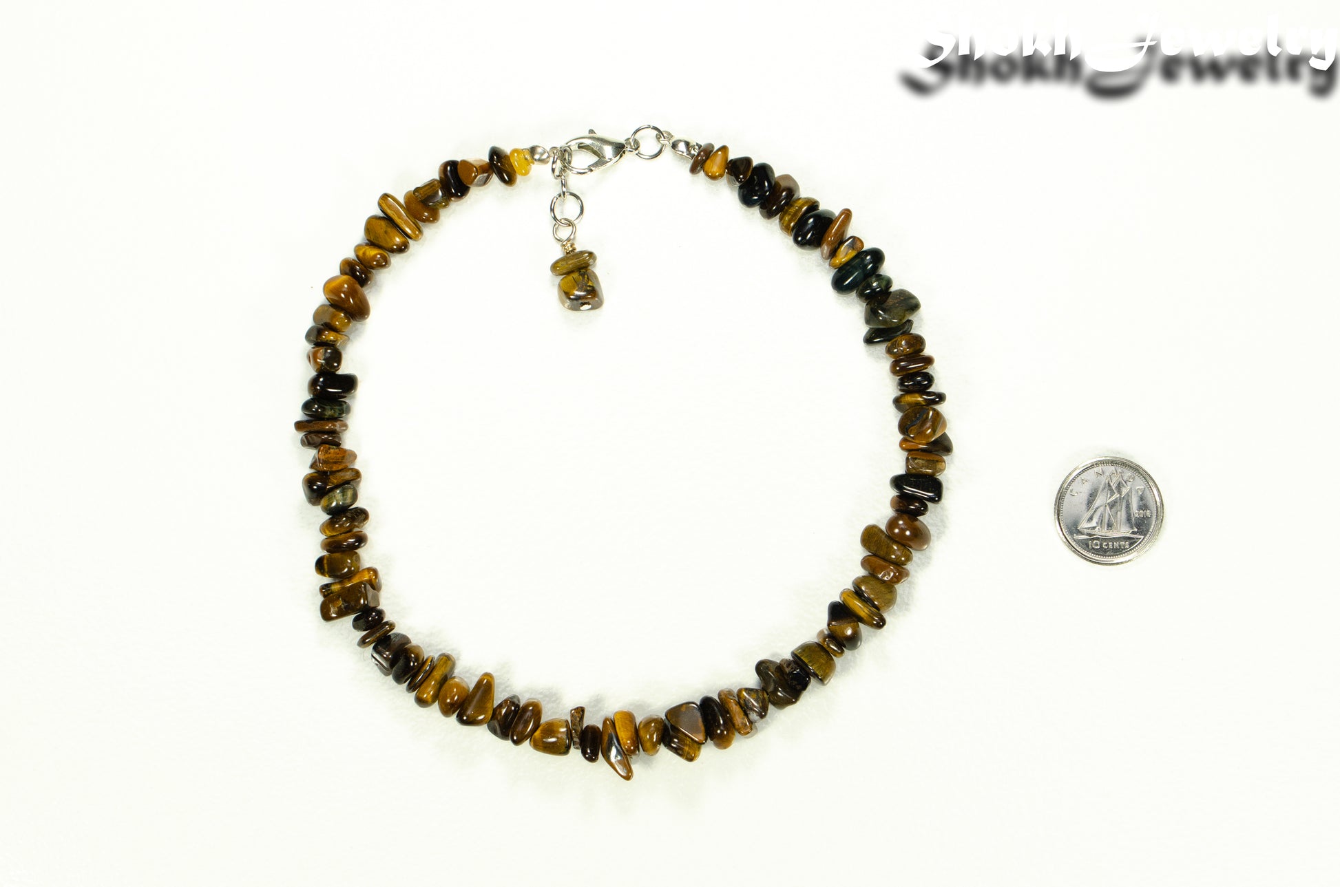 Natural Tiger's Eye Chip Anklet beside a dime.