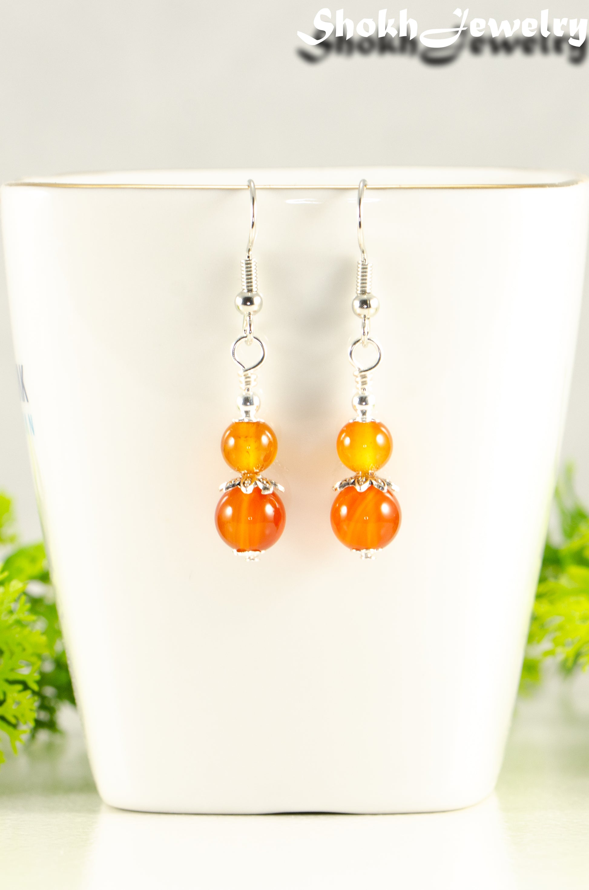 Close up of Small Natural Carnelian Earrings.