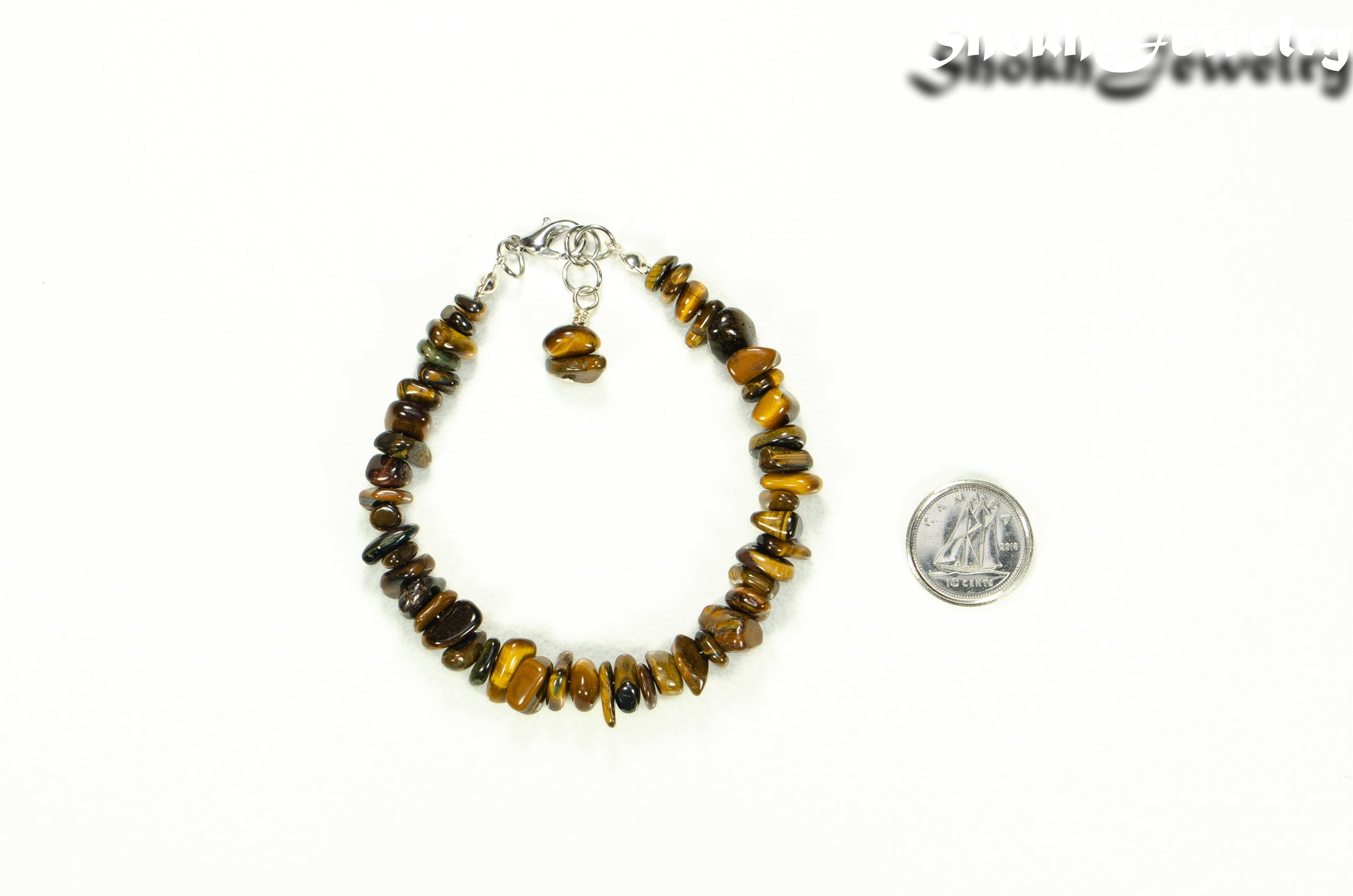 Natural Tiger's Eye Chip Bracelet beside a dime.