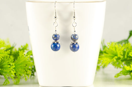 Small Lapis Lazuli Earrings displayed on a tea cup.