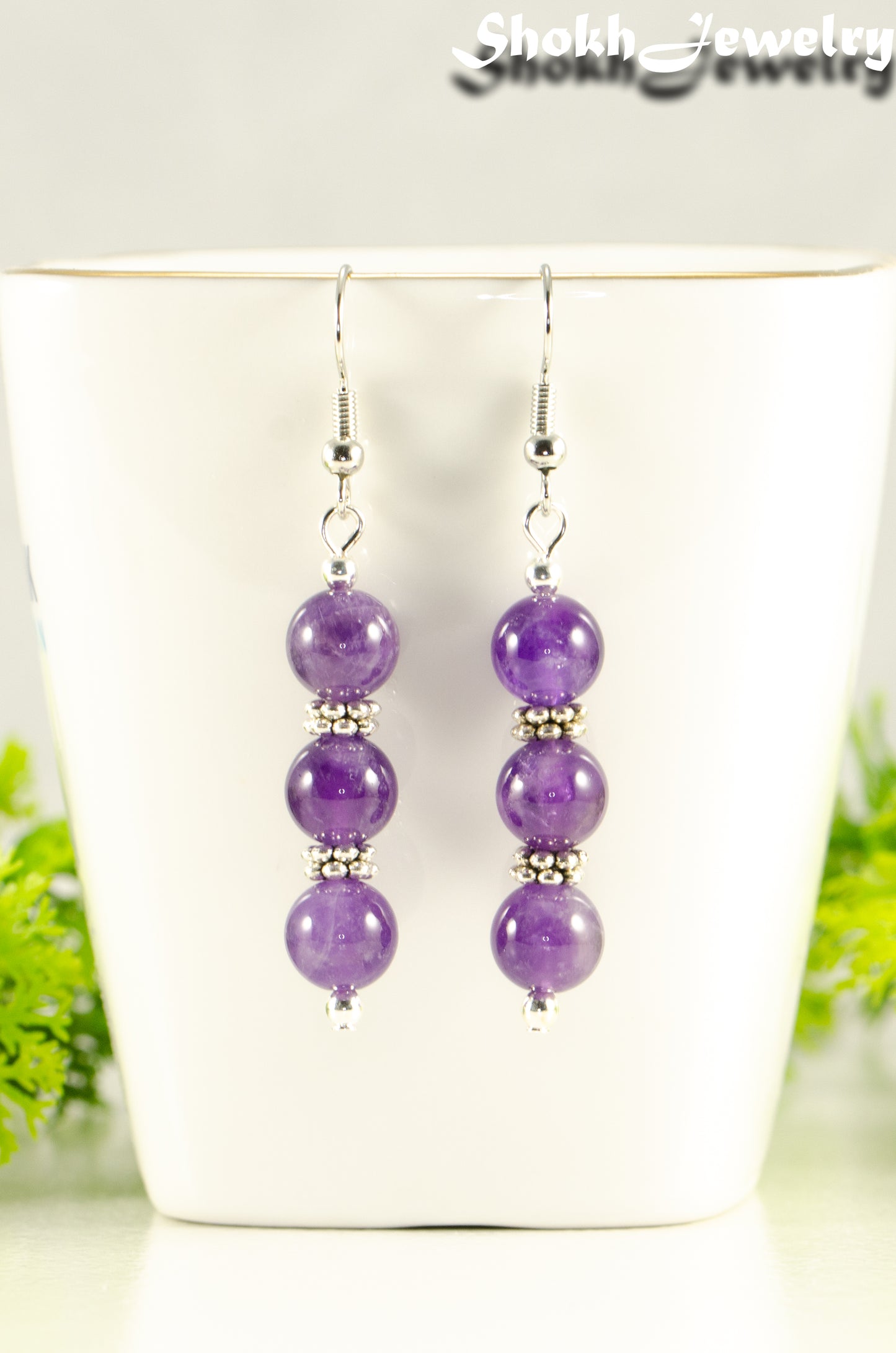 Close up of Natural Amethyst Beaded Bar Earrings.