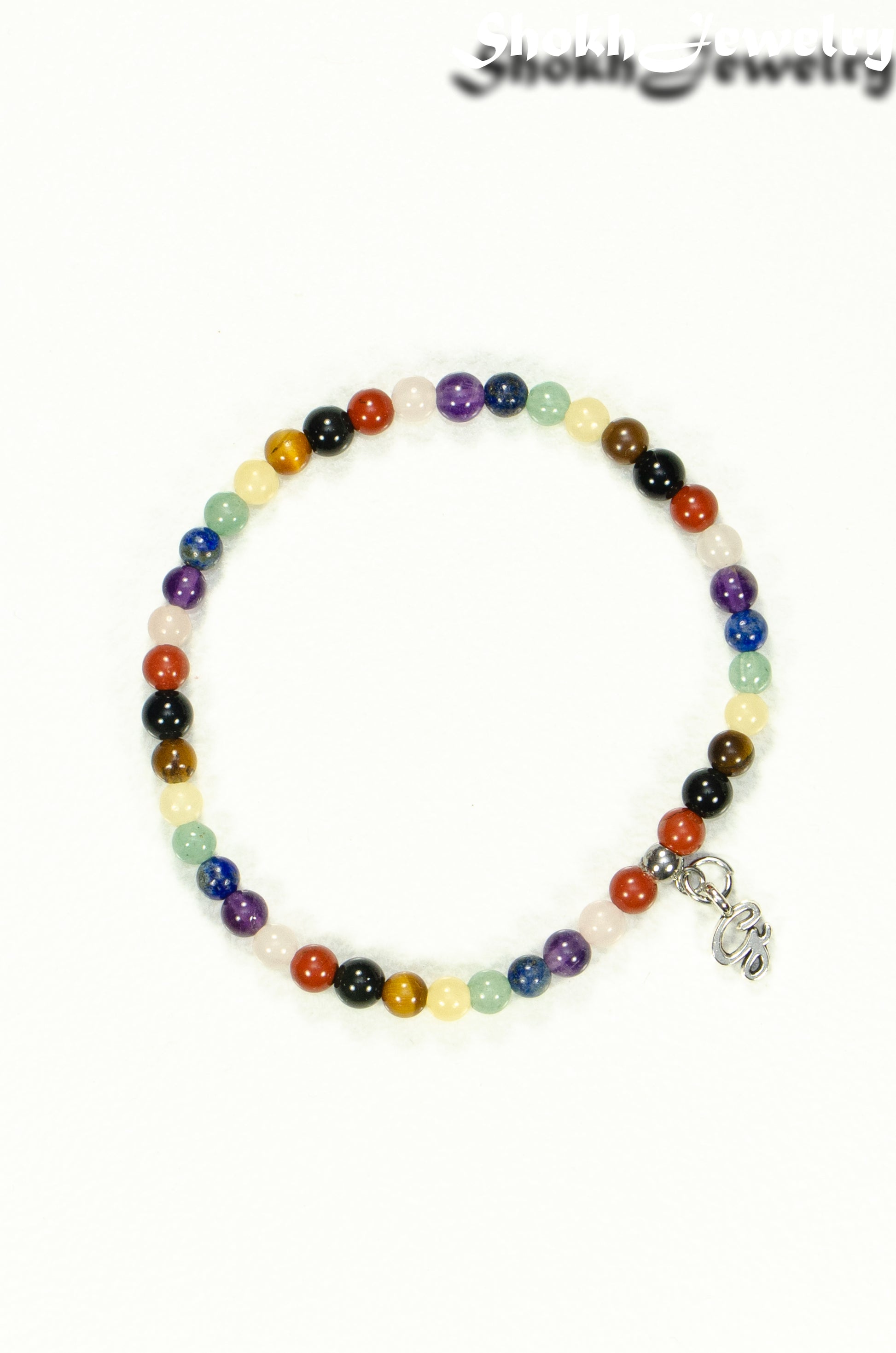 Top view of Dainty Gemstone Chakra Bracelet with Initial.