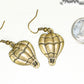 Antique Bronze Hot Air Balloon Charm Earrings beside a dime.