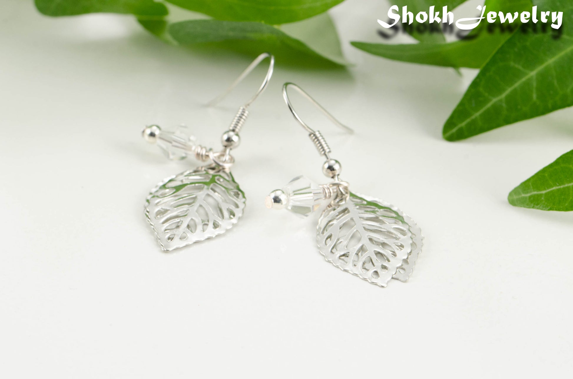 Filigree Silver Leaf Charm and Clear Glass Crystal Earrings for women.