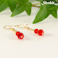 Small Red Glass Bead Dangle Earrings with gold tone ear wires.