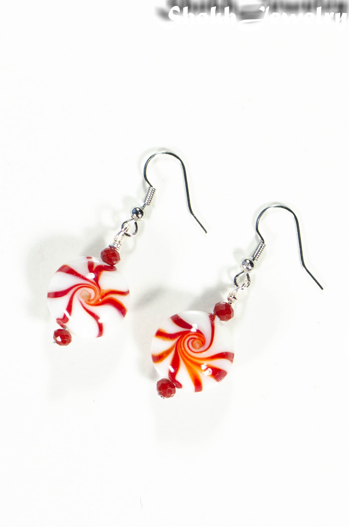 Top view of Christmas Peppermint Glass Bead Earrings.