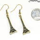 Antique Bronze 3D Eiffel Tower Charm Earrings beside a dime.