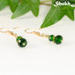 Small Dark Green Glass Bead Dangle Earrings with gold tone ear wires.