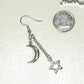 Crescent Moon and Hollow Star Earrings beside a dime.