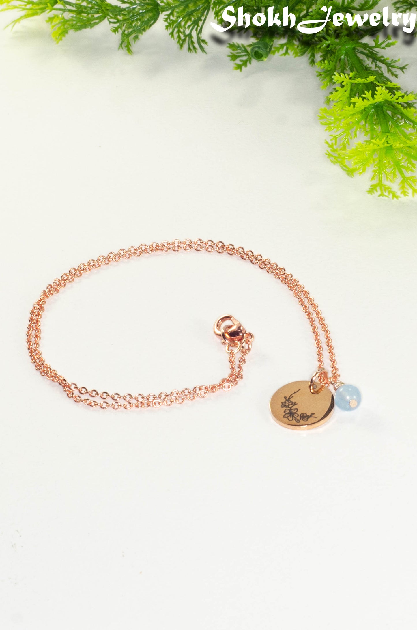 Rose Gold Plated March Birth Flower Necklace with Aquamarine Birthstone Pendant.