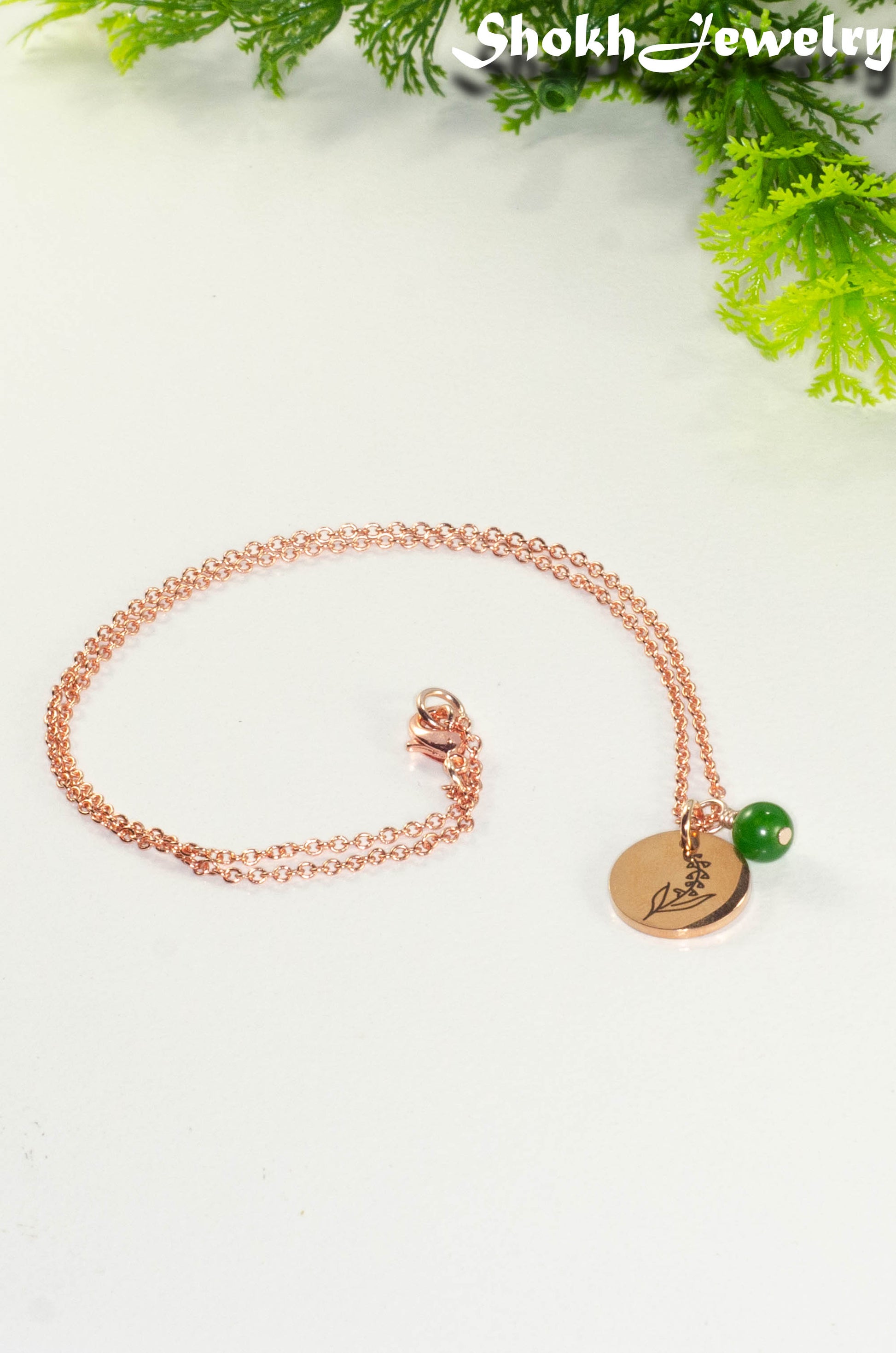 Rose Gold Plated May Birth Flower Necklace with Emerald Birthstone Pendant.