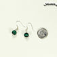 Small Genuine Malachite Drop Earrings beside a dime.