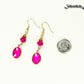 Hot Pink Oval Glass Dangle Earrings beside a dime.