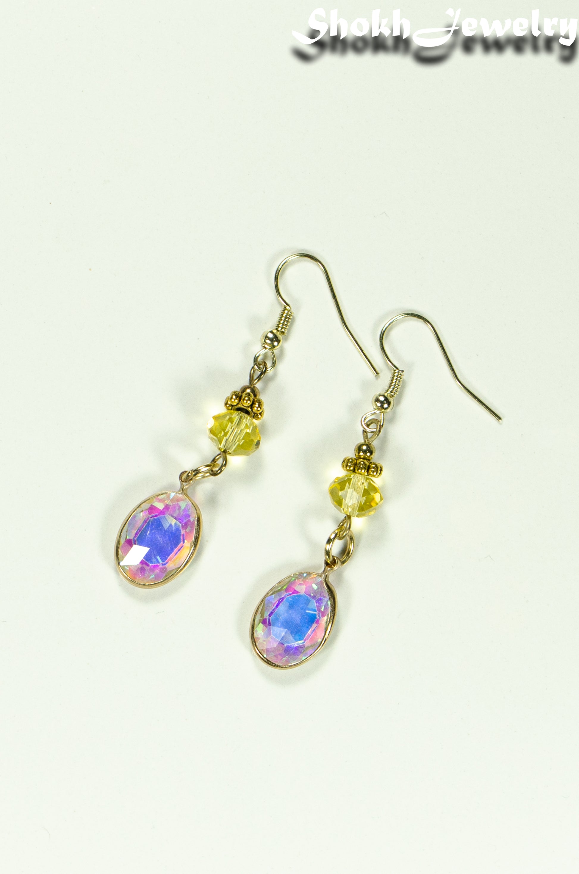 Top view of Light Yellow Oval Glass Dangle Earrings.