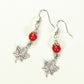 Top view of Red Howlite and Tibetan Silver Maple Leaf Dangle Earrings.