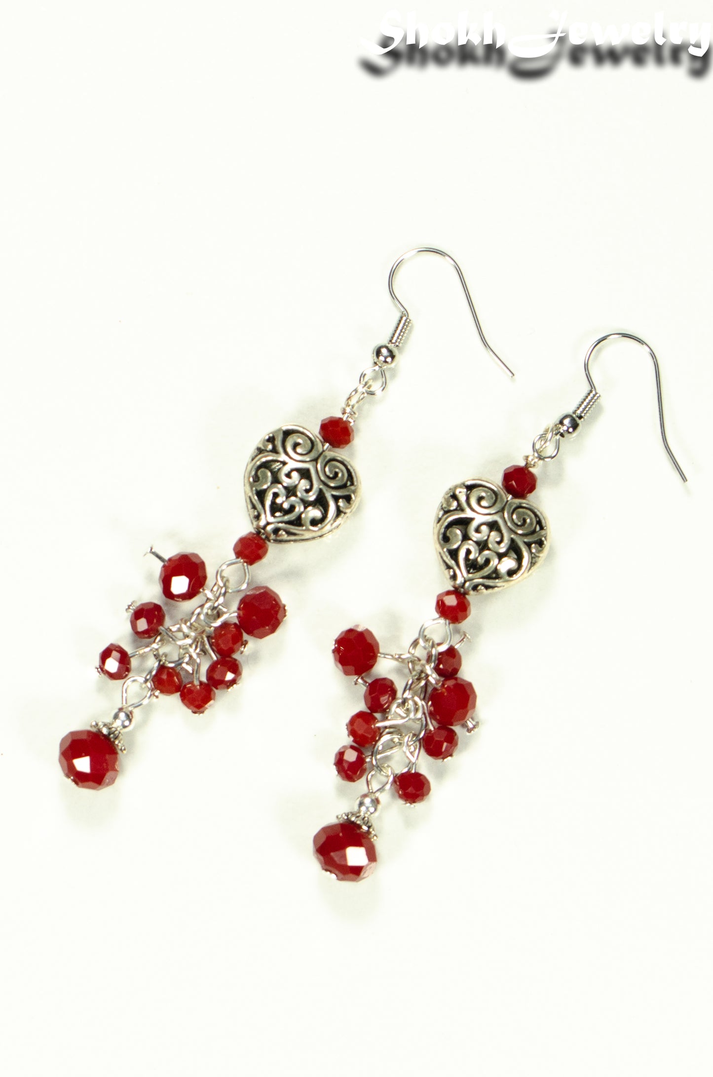 Top view of Tibetan Silver Heart and Red Beaded Cluster Earrings.