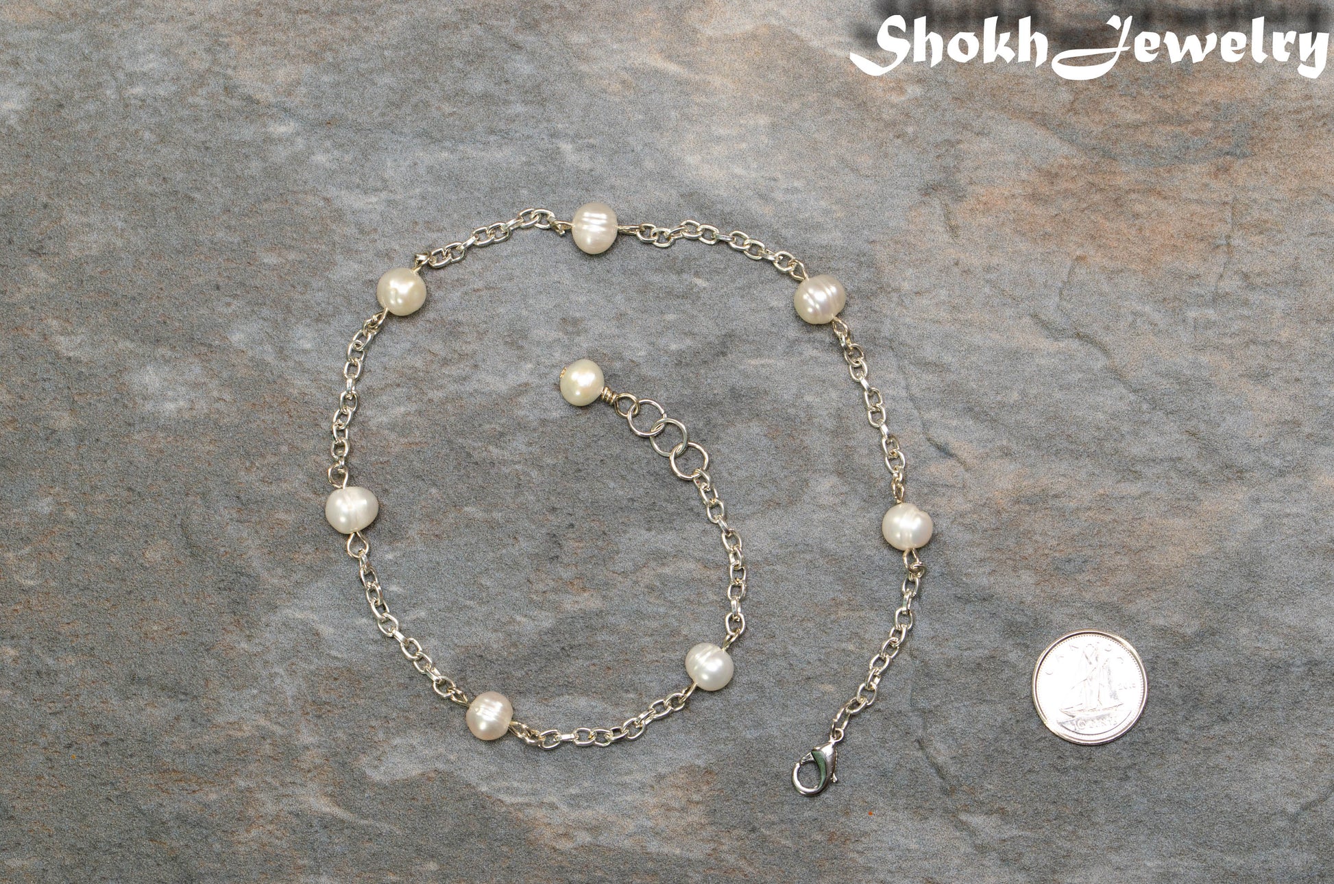 Freshwater Pearl and Chain Anklet beside a dime.