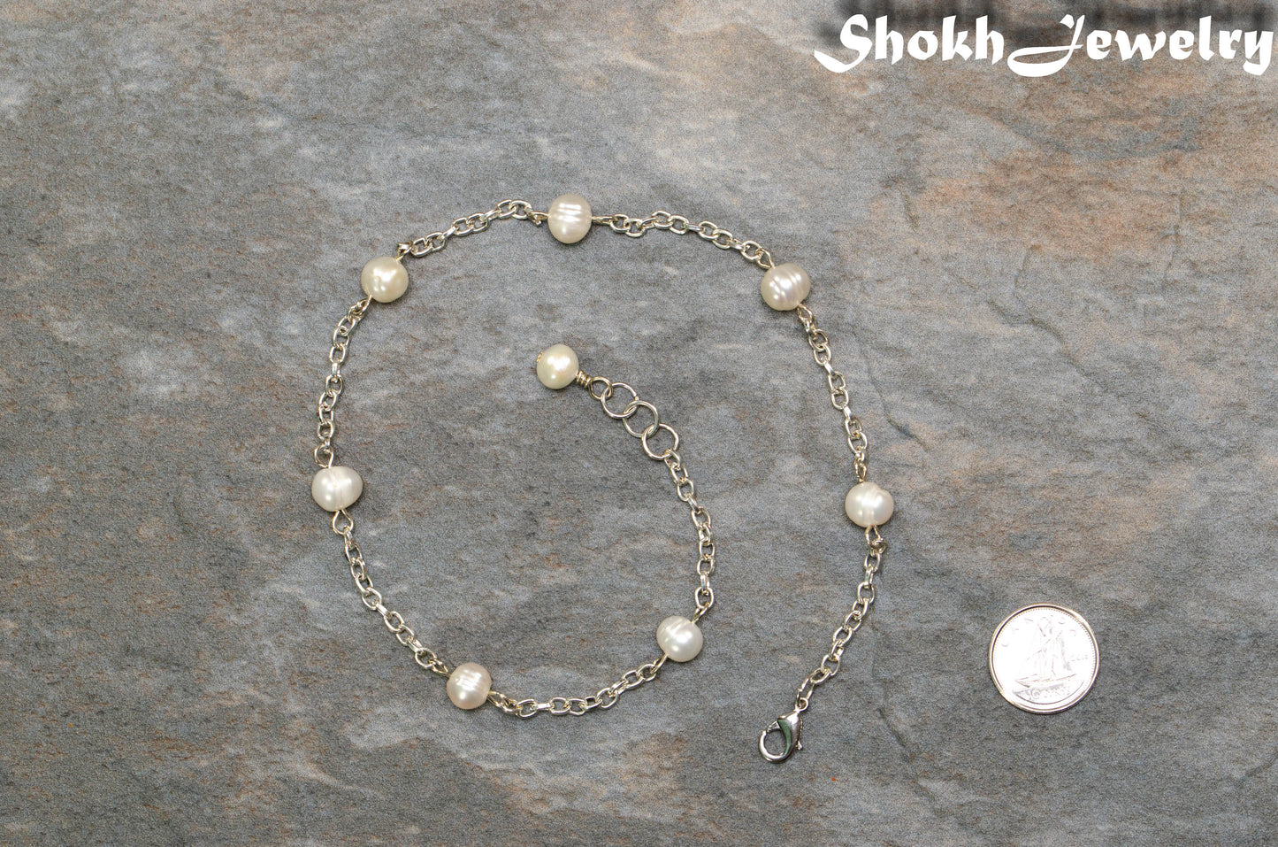 Freshwater Pearl and Dainty Chain Choker Necklace beside a dime.