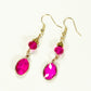 Top view of Hot Pink Oval Glass Dangle Earrings.