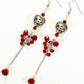 Top view of Statement Tibetan Silver Heart and Red Beaded Cluster Earrings.