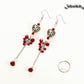 Statement Tibetan Silver Heart and Red Beaded Cluster Earrings beside a dime.