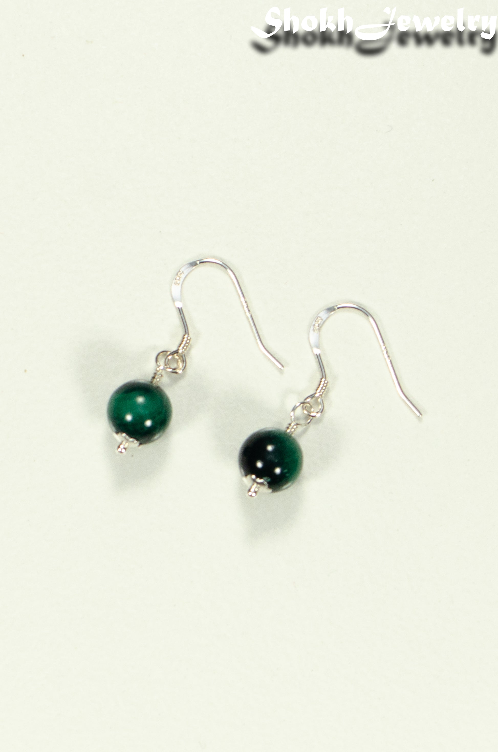 Top view of Small Genuine Malachite Drop Earrings.