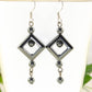 Close up of Long Black Hematite Geometric Earrings.