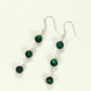 Top view of Long Genuine Malachite Dangle Earrings.