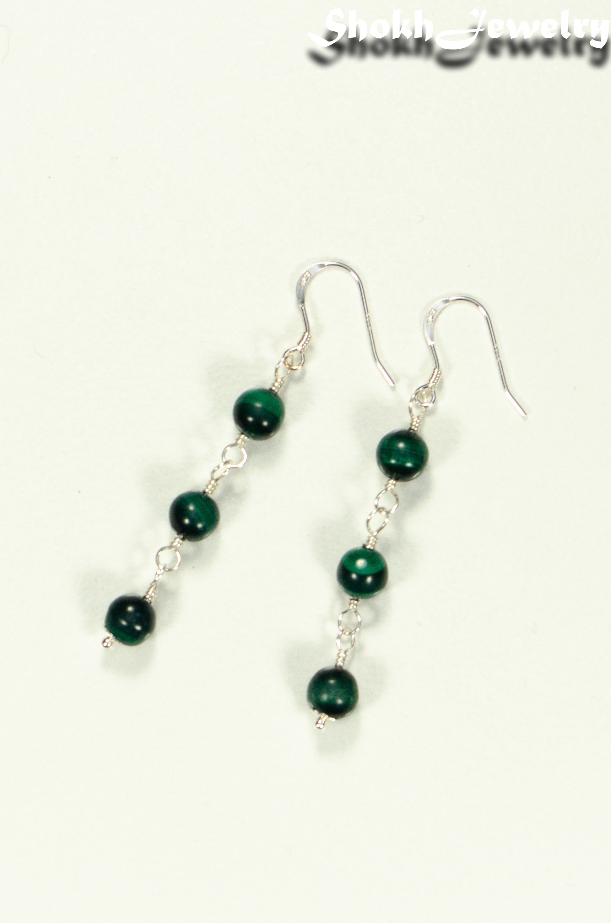 Top view of Long Genuine Malachite Dangle Earrings.