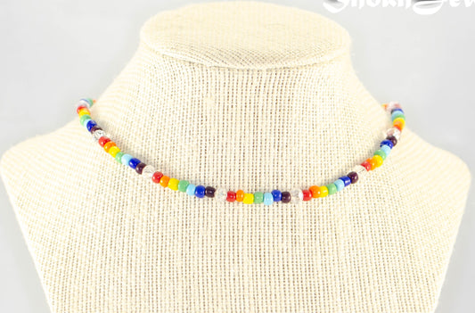 Clear Glass Crystal and Rainbow Seed Bead Choker Necklace displayed on a bust.