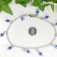 Navy Blue Glass Crystal Dangle and Chain Anklet beside a dime.