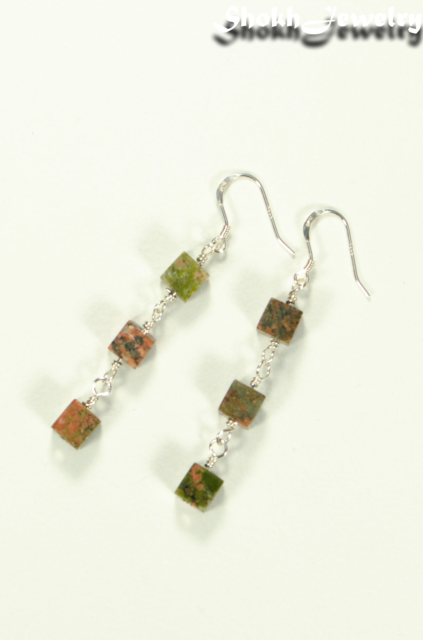 Top view of Long Unakite Cube Dangle Earrings.