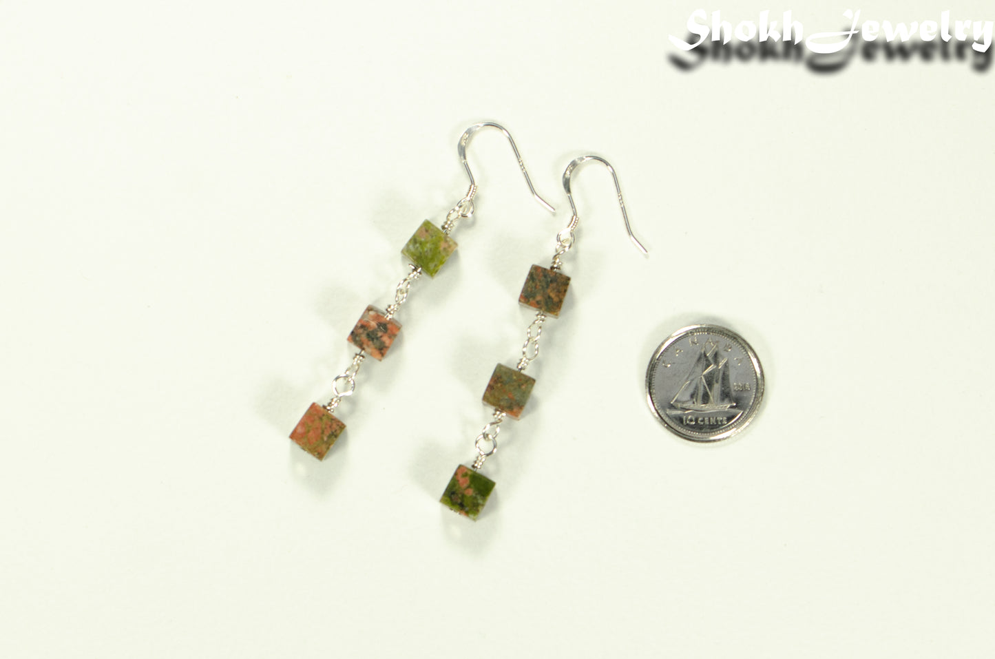 Long Unakite Cube Dangle Earrings beside a dime.