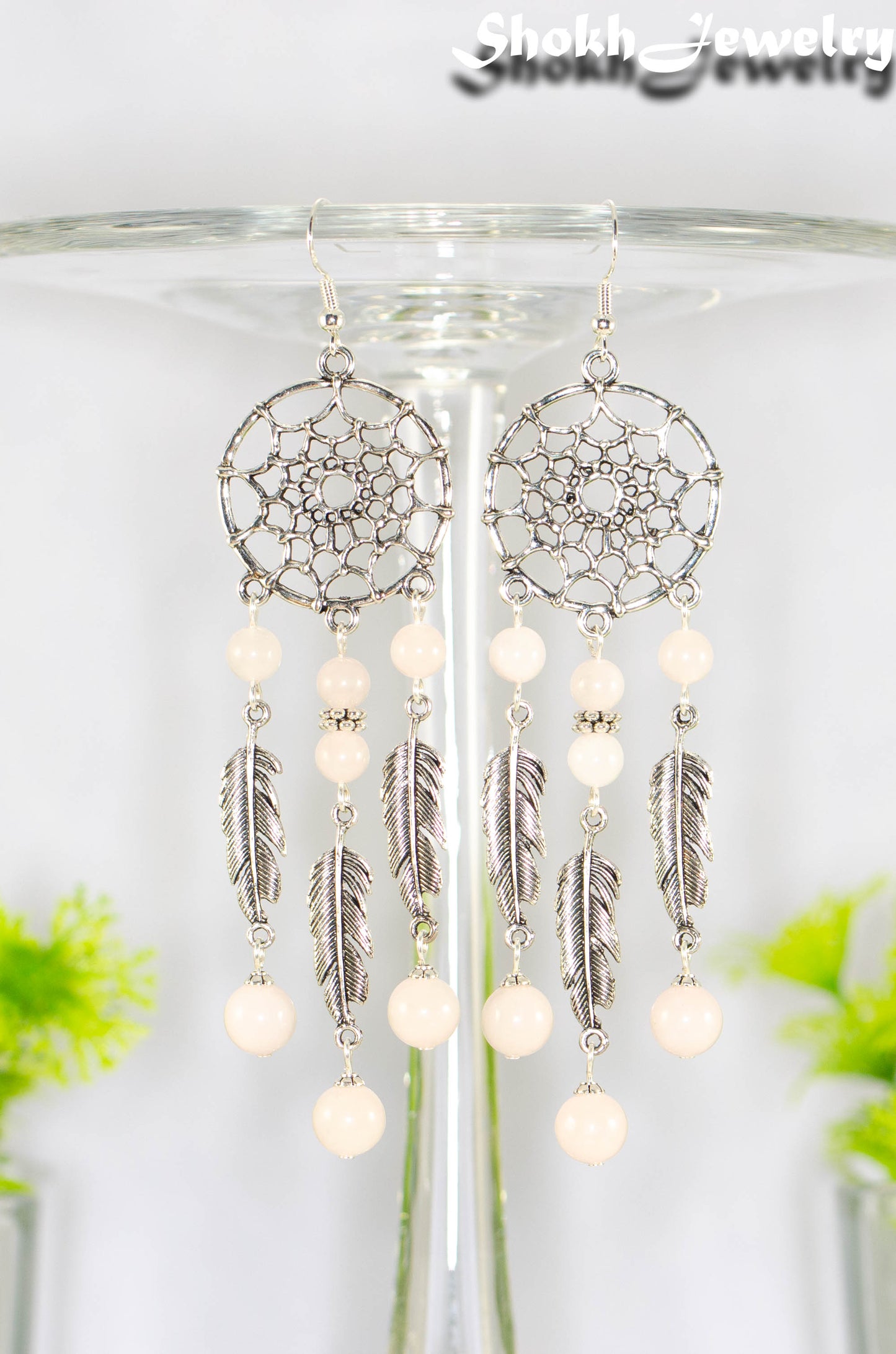 Close up of Extra Long Rose Quartz Dream Catcher Earrings.