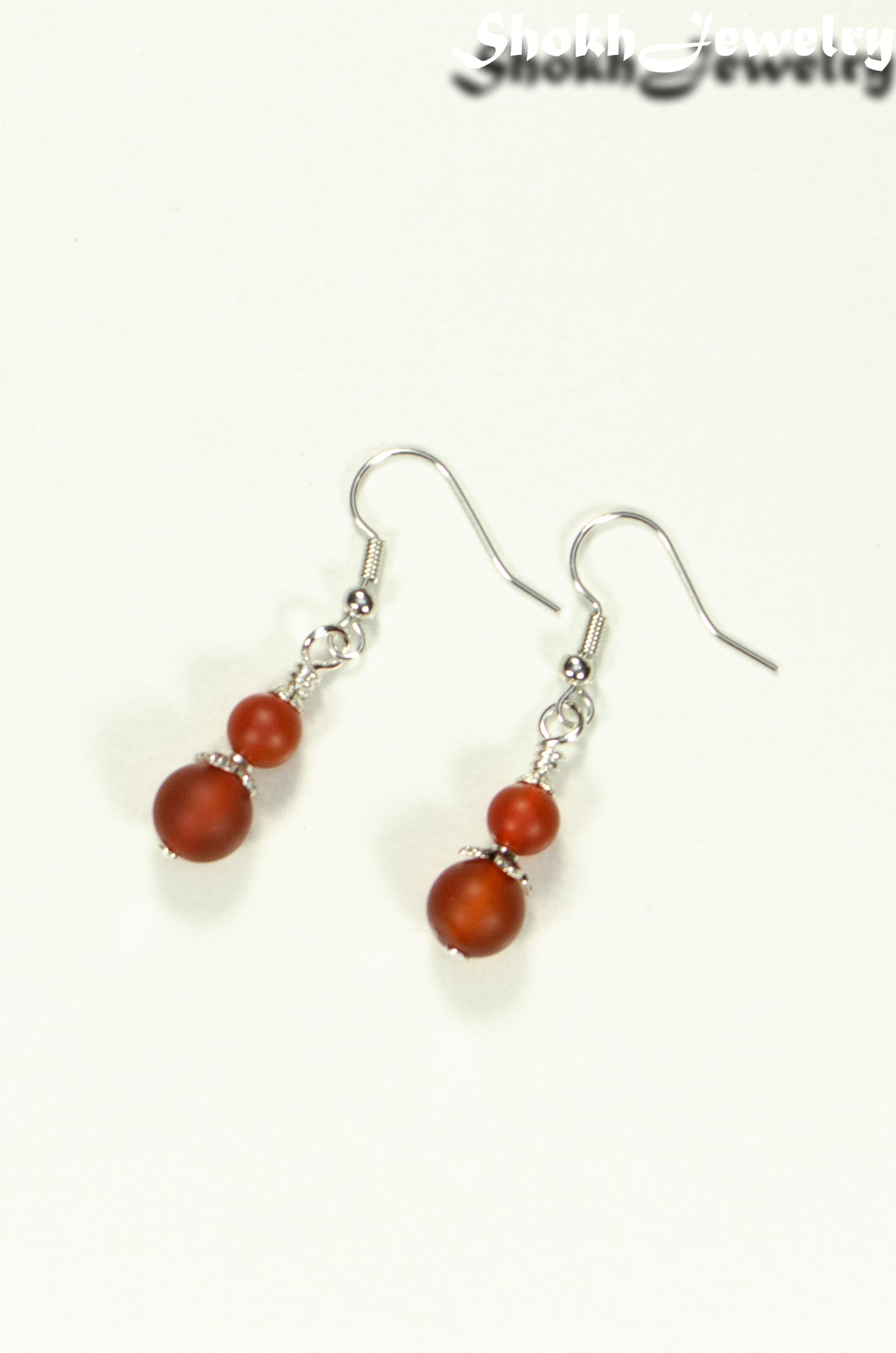 Top view of Small Matte Red Agate Earrings.