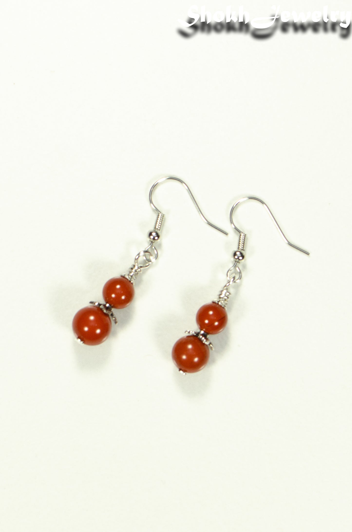 Top view of Small Natural Red Jasper Earrings.