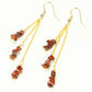 Top view of Long Gold Plated Chain and Red Jasper Chip Earrings.