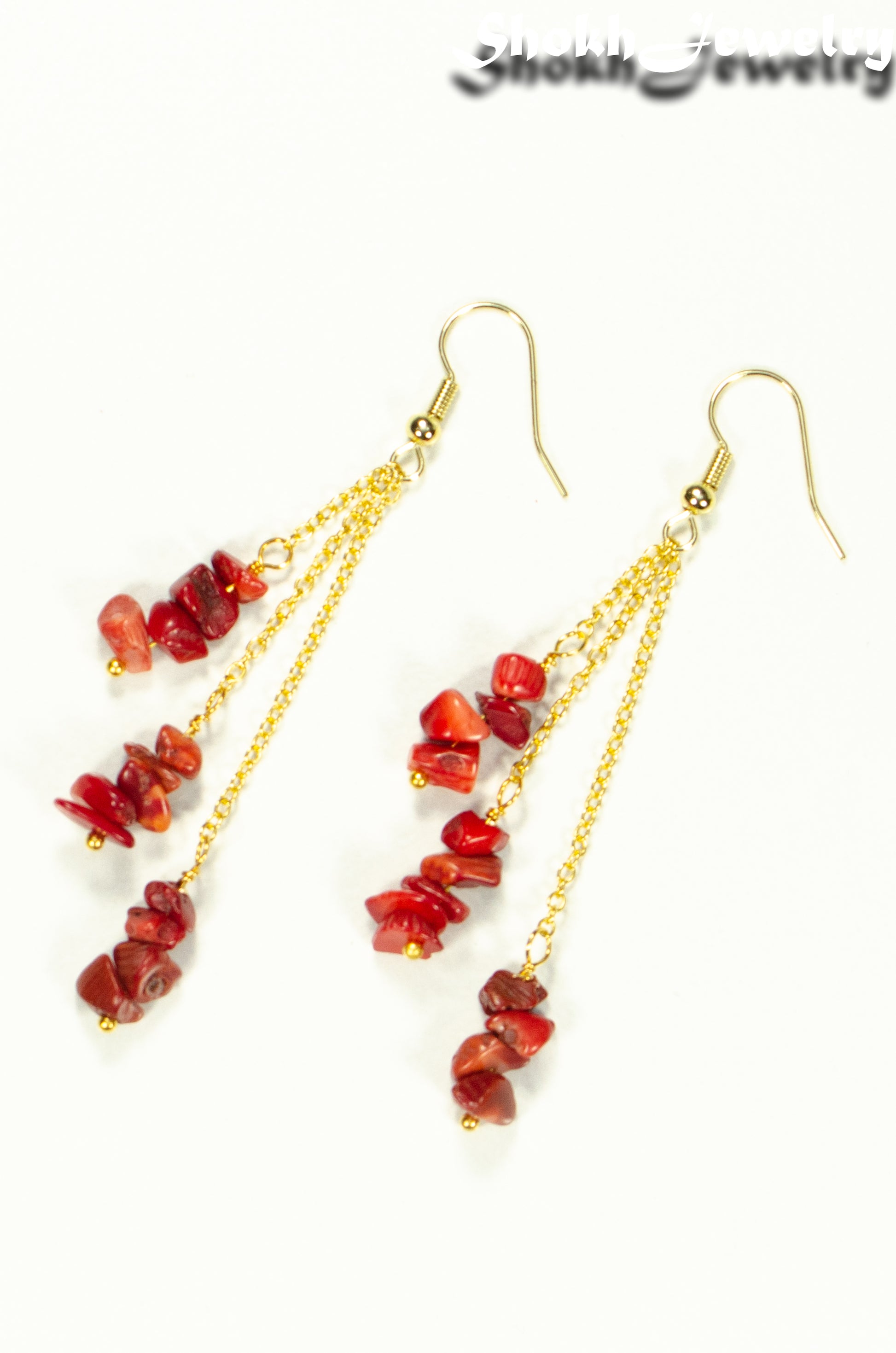 Top view of Long Gold Plated Chain and Red Dyed Bamboo Coral Chip Earrings.