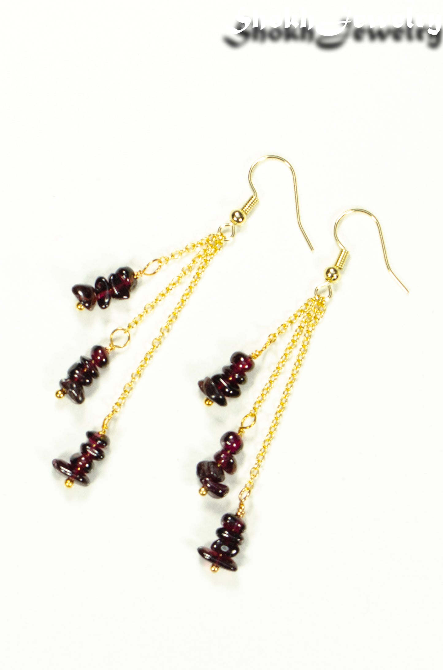 Top view of Long Gold Plated Chain and Garnet Crystal Chip Earrings.